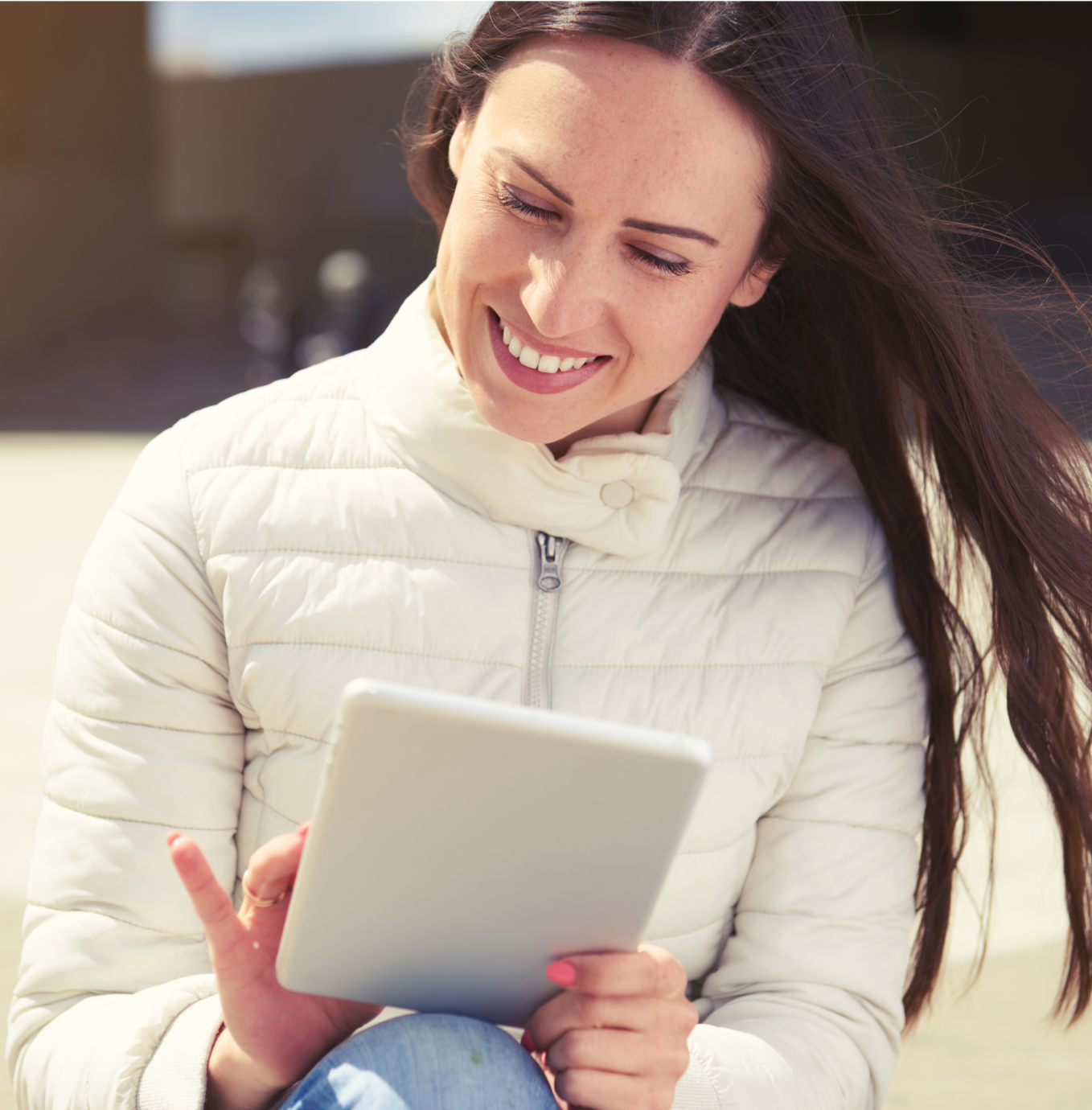 A woman is using a tablet